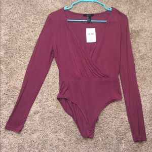 Body suit. never worn. Tags on